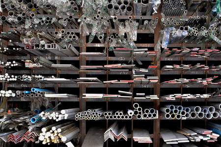 Shelf with many kind of iron and construction materialの写真素材
