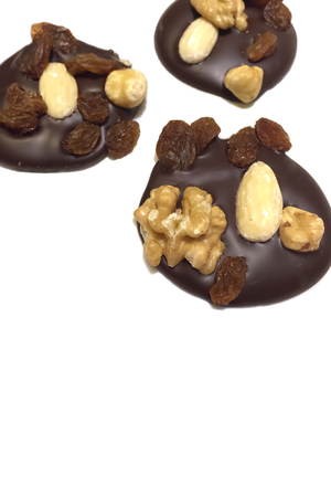 Mendiant, Traditional French confection, chocolate disk top with nuts and dried friutsの写真素材