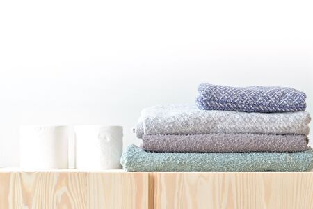 Paper towels and Folded towel on the cupboard at homeの写真素材
