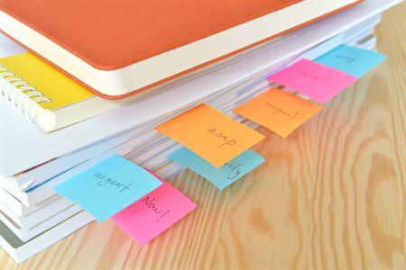 Urgent work with stack of document at officeの写真素材