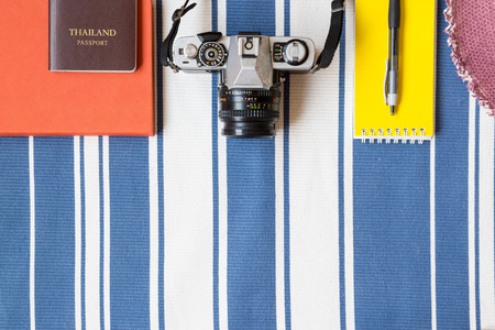 Travel background with notebook, old camera and passportの写真素材