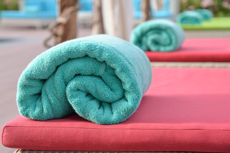 Colorful beach towel on sun loungerの写真素材