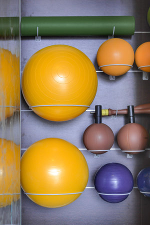 Fitness equipment on storage rack eg. ball, mattressの写真素材
