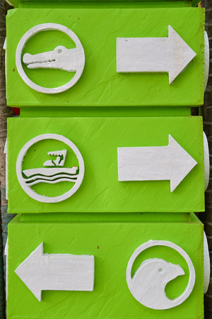 Directional zoo sign on a green postの写真素材