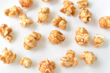 Caramel popcorn on white background - isolatedの写真素材