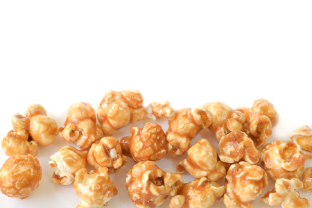 Caramel popcorn on white background - isolatedの写真素材