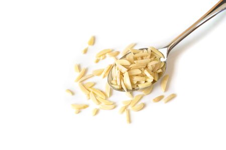 Almond chopped on white background - isolatedの写真素材