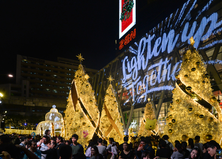 Many people come to taking picture of Christmas and New Year decoration light in front of Central World department store, Bangkok Thailandのeditorial素材