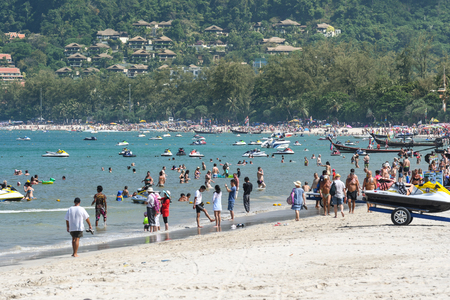 Phuket, Thailand - February 13, 2017: Many tourists come to enjoy the beach in a sunny day at Patong beach, Phuket, Thailandのeditorial素材