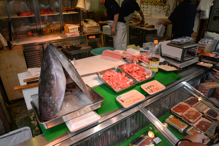 Tokyo, Japan - May 16, 2017: Raw cut tuna, Otoro, is sold along the street at Tsukiji fish market, Tokyo, Japanのeditorial素材