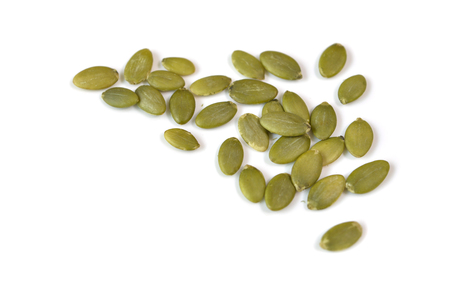 Pumpkin seeds on white background - isolatedの写真素材