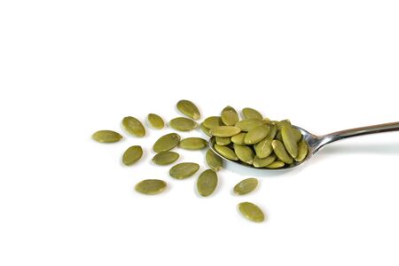 Pumpkin seeds on white background - isolatedの写真素材