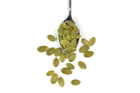 Pumpkin seeds on white background - isolatedの写真素材