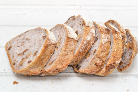 Walnut bread on white wooden backgroundの写真素材