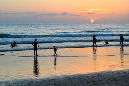 Phuket, Thailand - July 23, 2017: People enjoy the beach during sunset at Surin Beach, Phuket, Thailandのeditorial素材