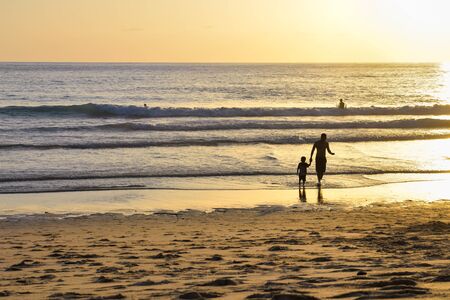 Phuket, Thailand - July 23, 2017: People enjoy the beach during sunset at Surin Beach, Phuket, Thailandのeditorial素材