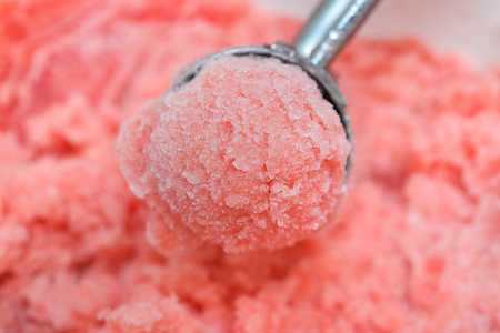 Homemade watermelon sorbet scoopの写真素材