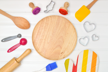 Baking utensils with wooden plate from top viewの写真素材