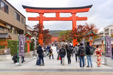 Kyoto, Japan - November 17, 2016: Many tourists are walking in and out Fushimi Inari Shrine, which famous for its thousands of vermilion torii gates, Kyoto, Japanのeditorial素材