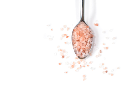 Pink himalayan salt on white background - isolatedの写真素材