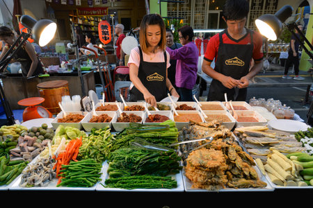 Phuket, Thailand - March 25, 2018: Local vendors are selling chilli paste with variety of vegetables...