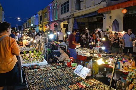 Phuket, Thailand - March 25, 2018: Many tourists are shopping along the street at Lard Yai, Phuket weekend market, in Phuket old town area, Thailand.のeditorial素材