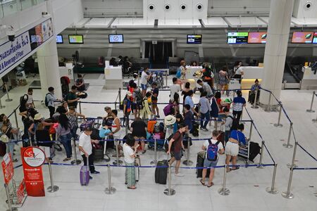Phuket, Thailand - March 26, 2018: Many tourists are queuing to check in at domestic terminal, Phuket airport, Thailand.のeditorial素材