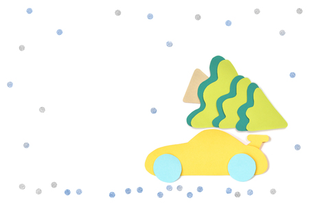 Car with christmas tree paper cut on white background - isolatedの写真素材