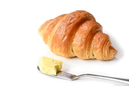 Croissant with butter on white background - isolatedの写真素材