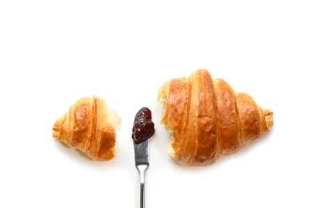 Croissant with jam on white background - isolatedの写真素材