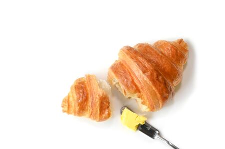 Croissant with butter on white background - isolatedの写真素材