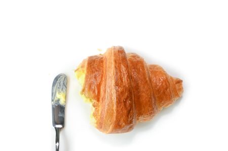 Croissant with butter on white background - isolatedの写真素材