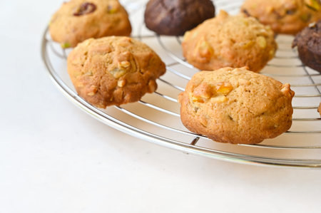 Homemade cookies on wire rack on white background
