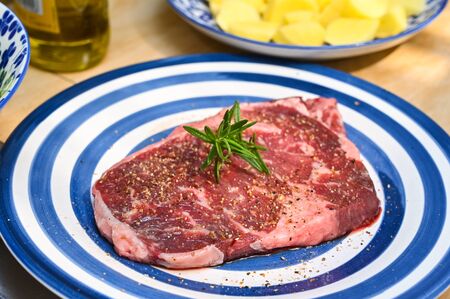 Cooking steak and vegetables at homeの写真素材