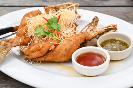 Deep fried sea bass with fish sauce - Thai food