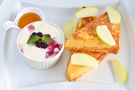 French toast with yogurt and fruitsの写真素材