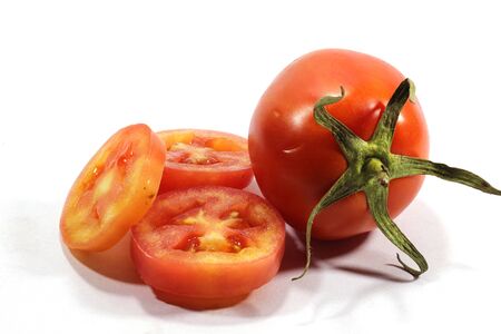 Fresh tomatoes on a white backgroundの写真素材