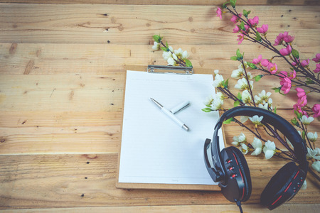 Blank diary and pen on wood backgroundの写真素材