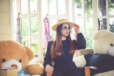Women wearing black dress modeled in a cafe.の写真素材