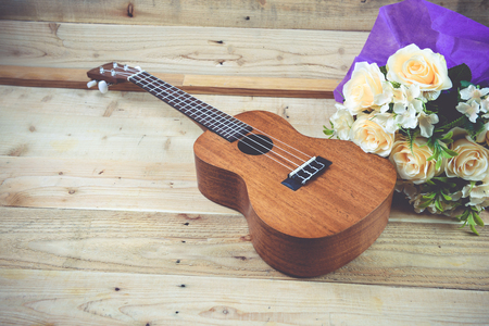 Ukulele on a wooden background.Vintage Conceptの写真素材