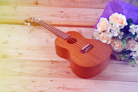 Ukulele on a wooden background.Vintage Conceptの写真素材