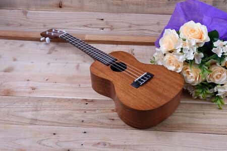 Ukulele on a wooden background.Vintage Conceptの写真素材
