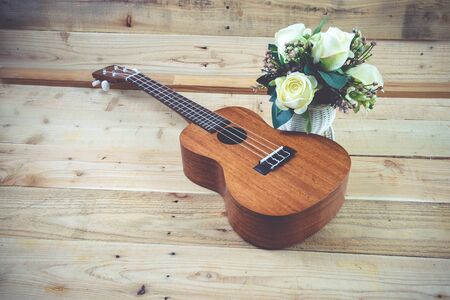 Ukulele on a wooden background.Vintage Conceptの写真素材