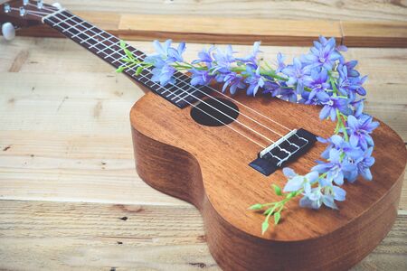 Ukulele on a wooden background.Vintage Conceptの写真素材