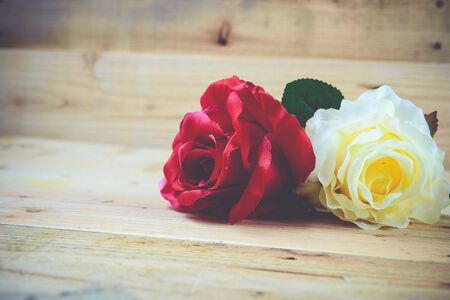 White and red roses on a wooden background.Vintage Conceptの写真素材
