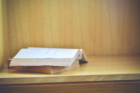 Old books on a wooden background.,Vintage Conceptの写真素材