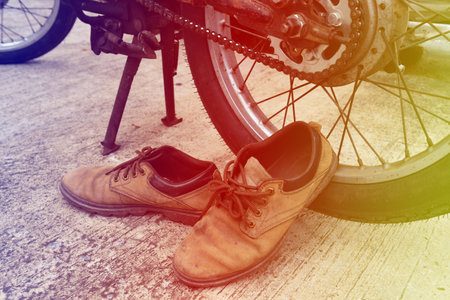 Men's leather shoes and old Motorcycles.,Vintage concept