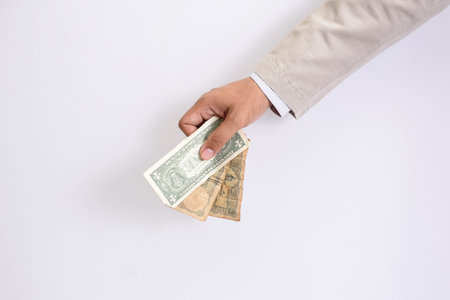Hands of businessmen and money