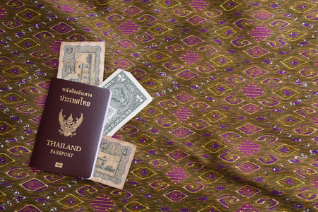 Passport of Thailand,On the background of silk Thailand.の写真素材