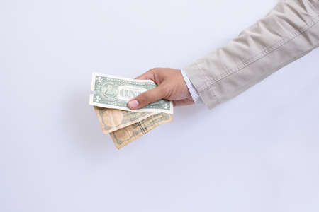 Hands of businessmen and moneyの写真素材